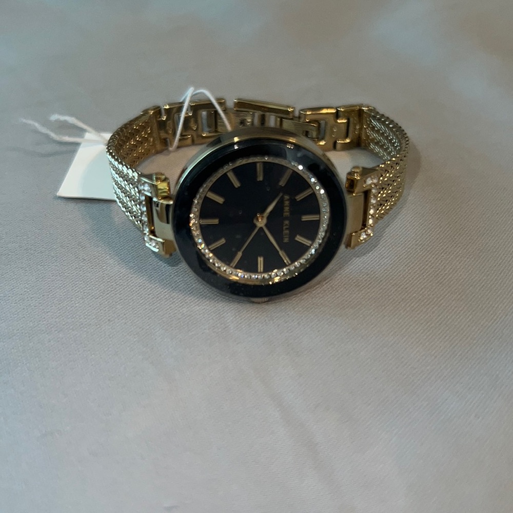 Anne Klein hold and black watch.